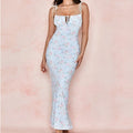 A light blue floral print dress with puff sleeves, thin white straps, and a square neckline for women