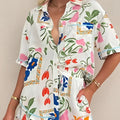 White floral slim fit short sleeve shirt set featuring a button-up dress with vibrant pink blue and orange flowers