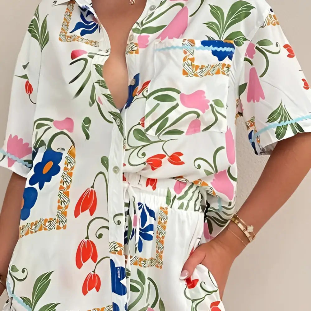 White floral slim fit short sleeve shirt dress with vibrant pink blue and orange flowers on green stems