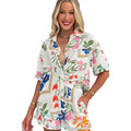 White floral slim fit short sleeve romper with button-down front and drawstring waist in lightweight fabric