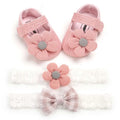 Pink knitted baby shoes with gray fabric center and white flower princess embellishment for toddlers