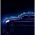 A sleek dark mercedes-benz sedan highlighted by neon lines with a white glass white mirror rearview driving recorder