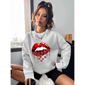 White pocketed long sleeve sweatshirt featuring bold red glitter lips graphic with dripping effect and small hearts below