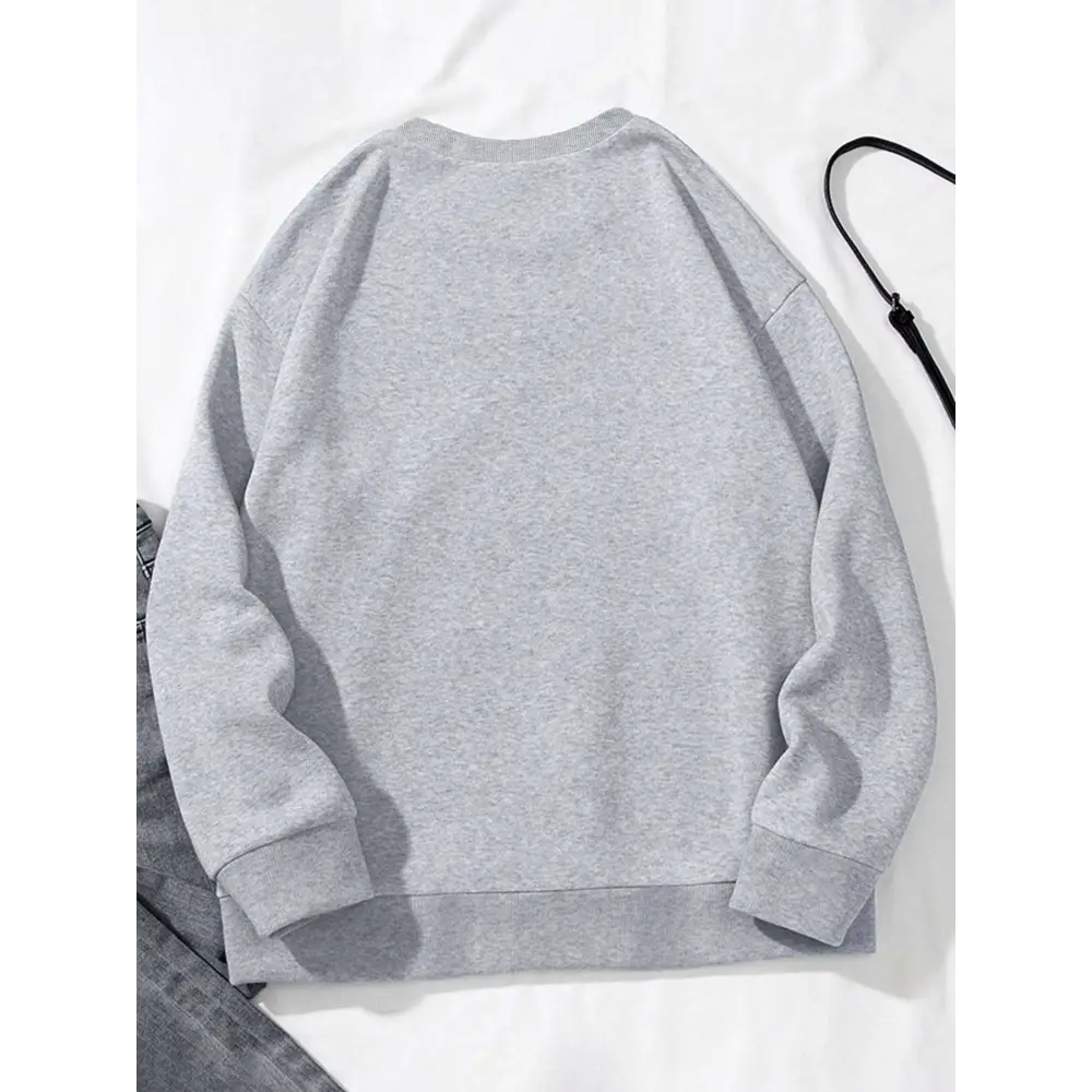 Gray heathered pocketed long sleeve sweatshirt featuring ribbed cuffs and hem with white glitter lips design