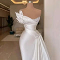 Elegant white graceful satin off-the-shoulder wedding dress with beaded embellishments and floral appliqués