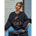 Black oversized long sleeve sweatshirt featuring a vibrant graphic leopard hat design with a woman in pink sunglasses