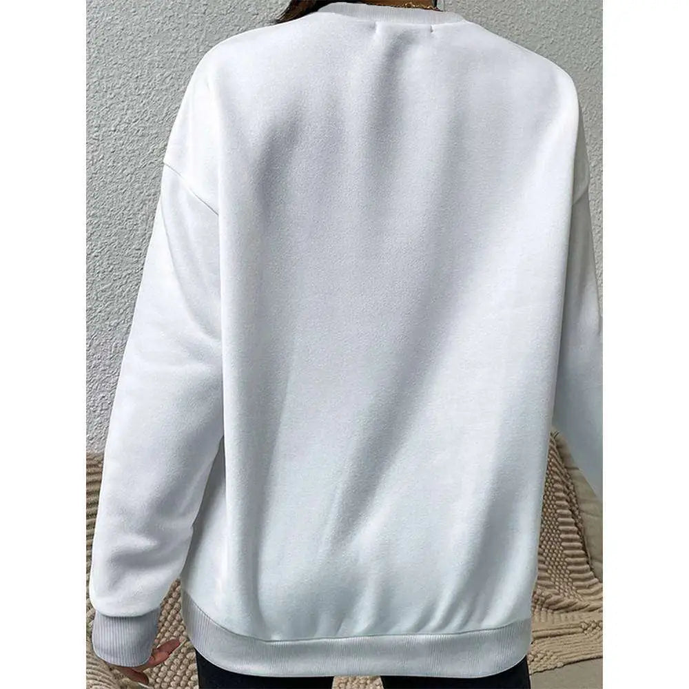 White graphic leopard long sleeve sweatshirt with oversized fit soft plush fabric and ribbed cuffs and hem
