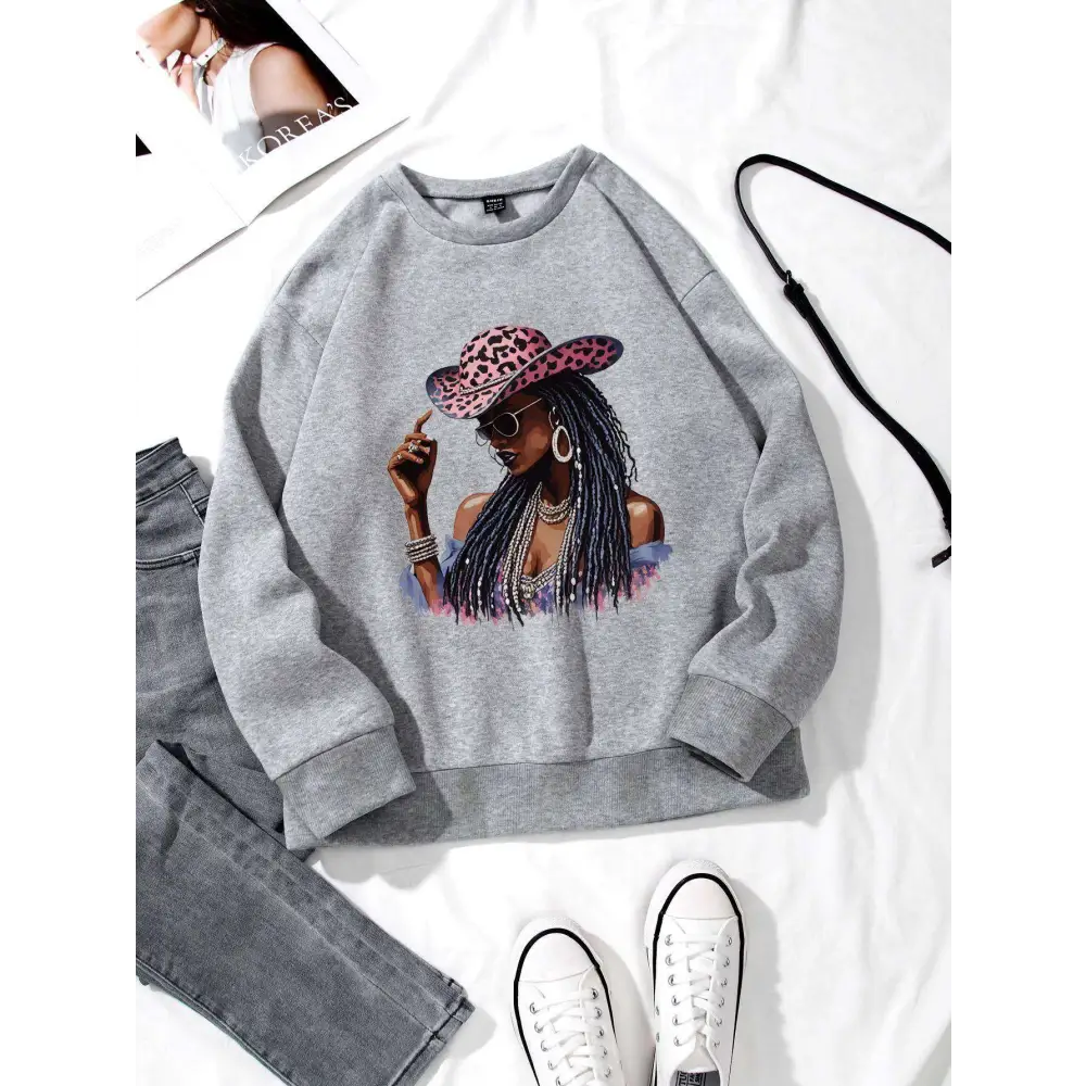 White long sleeve sweatshirt featuring a graphic leopard hat print of a woman in pink sunglasses