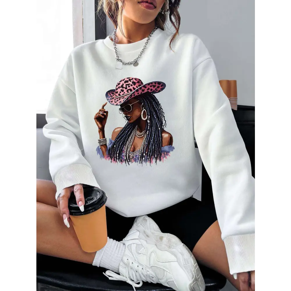 White long sleeve sweatshirt featuring a graphic leopard hat print of a woman in pink sunglasses