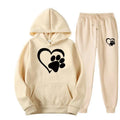 Cream-colored printed hoodie sets with white heart paw and black paw printed hoodie designs in matching joggers