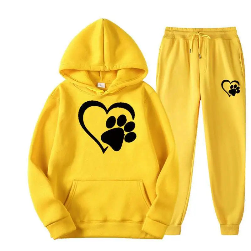 Bright yellow hooded sweatshirt and joggers set with black white heart paw printed hoodie graphics