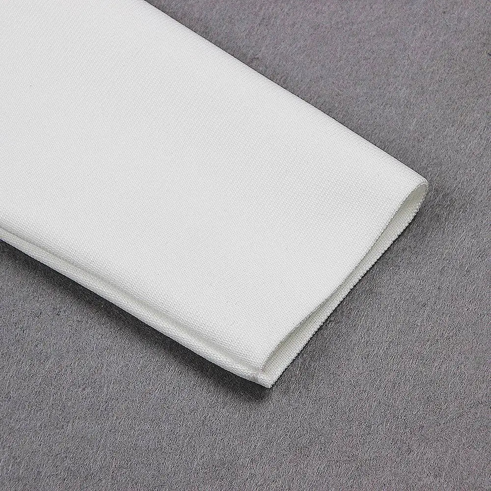 A crisp white fabric napkin with subtle woven texture displayed alongside a white high neck chest scheming hip short skirt