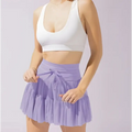 Lavender tiered pleated skirt with matching bow at the waist as an alternative to white high waist pleated skirt with safety pants summer
