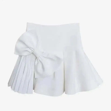 White high waist slimming pleated skirt with a large voluminous waist slimming bow and elegant skirt length