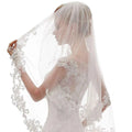 A delicate white ivory bridal veil with ivory embroidery applique and applique floral bridal design along edges