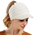White knitted women ponytail beanie with a small brim suitable for stylish cold weather wear