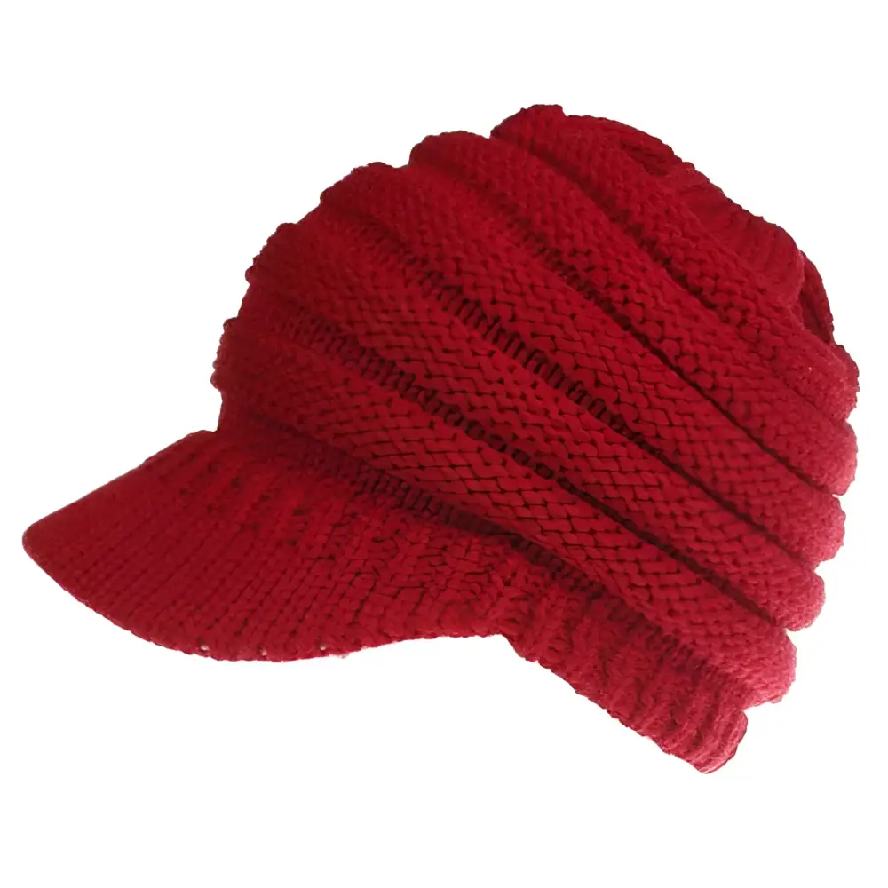 A vibrant red knitted women ponytail beanie with ribbed texture and brim suitable for outdoor wear