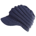 Cozy navy blue knitted women ponytail beanie with ribbed texture and structured brim suitable for outdoor wear