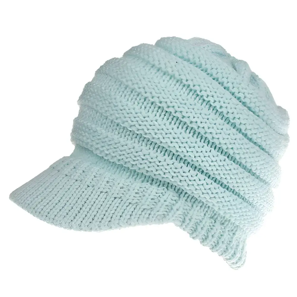 A soft mint green knitted women ponytail beanie with ribbed texture and a brim suitable for outdoor wear