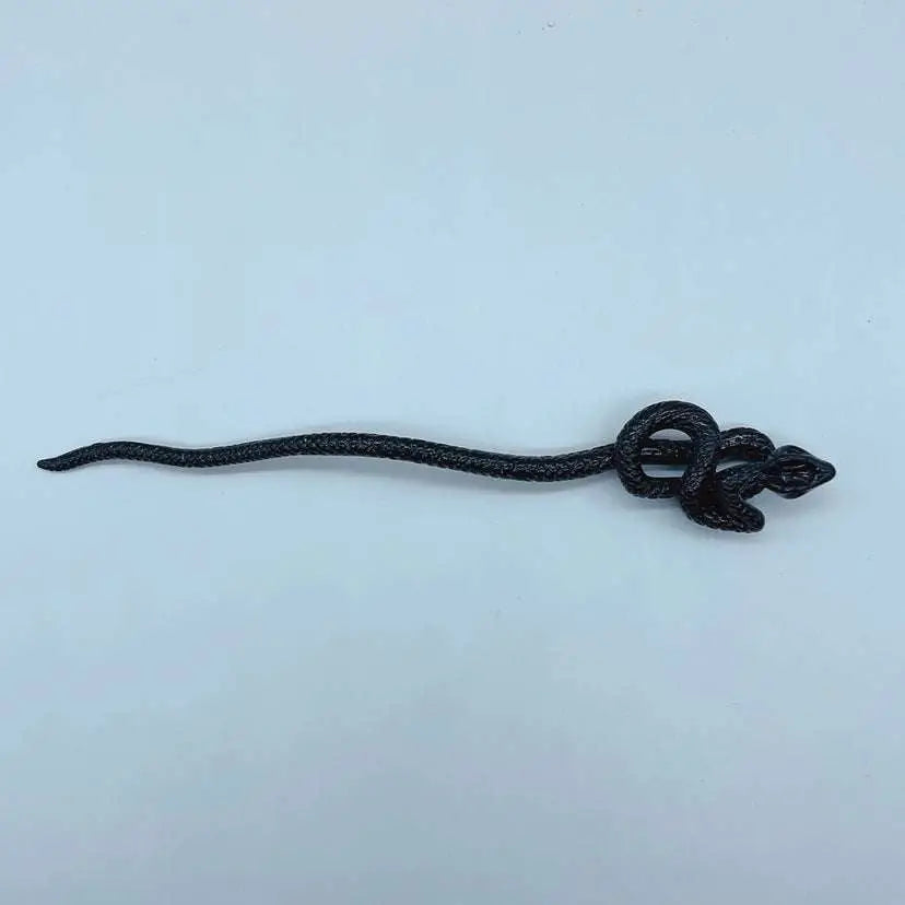 Black retro style hairpin featuring a white knotted rope design with an intricately coiled snake shape and braided texture