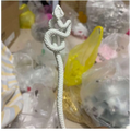 White knotted rope retro style hairpin featuring an intricately coiled snake figurine with textured scales and rope-like tail