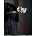 White knotted rope retro style hairpin with an intricately coiled snake design and smooth sculpted finish