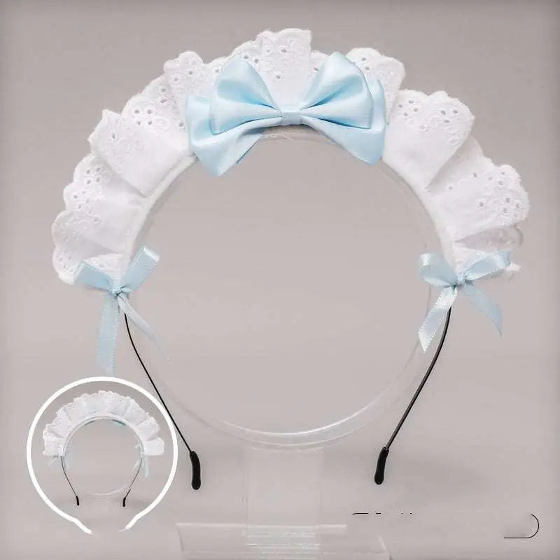 White lace bow maid headband featuring delicate lace and light blue satin bows at center and sides with red accents