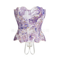A delicate white lace hollow out party club corset clothing with lavender accents and intricate circular cutouts