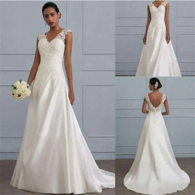 A flowing white lace satin wedding gown with delicate lace shoulders and back featuring a v-neckline and a-line silhouette