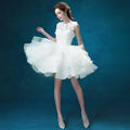 White lace tiered wedding short dress with short sleeves, delicate beading, and a tiered tulle skirt for brides