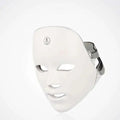 White led skin rejuvenation facial beauty device with a sleek surface and adjustable silver headband for facial use