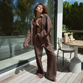 Brown linen button-up shirt with relaxed fit and long sleeves as part of a white linen long sleeve shirt trousers suit