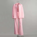 Pink cotton shirt trousers suit featuring a button-up shirt and wide-leg pants in a coordinated set