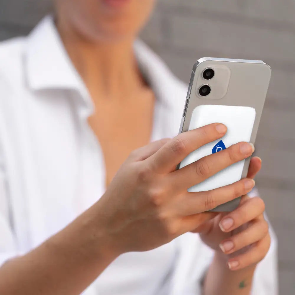 White magnetic wireless power bank with blue water droplet logo and magnetic wireless power phone grip