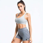 Gray athletic sports bra with thin straps and tummy control detail in white mesh yoga women’s activewear set
