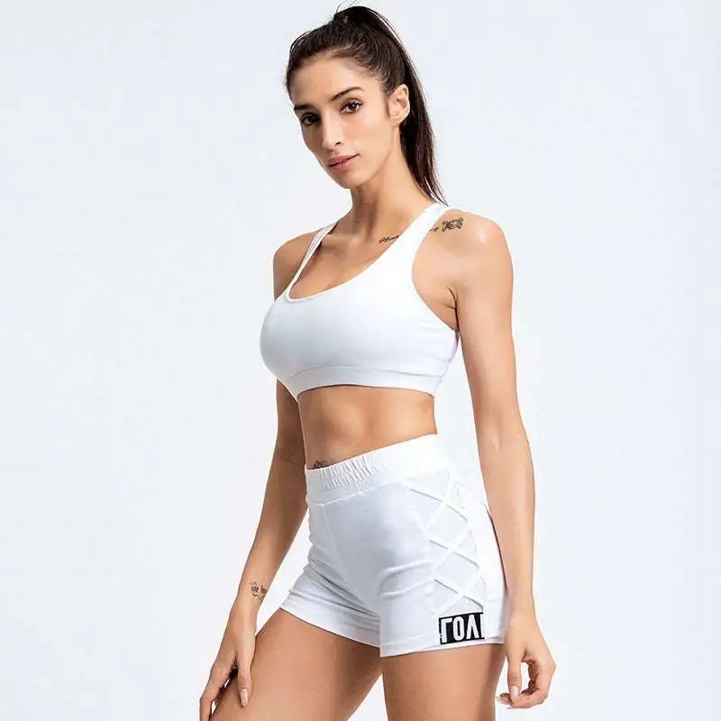 White mesh yoga sports bra in a women’s activewear set featuring solid fabric and racerback design for tummy control