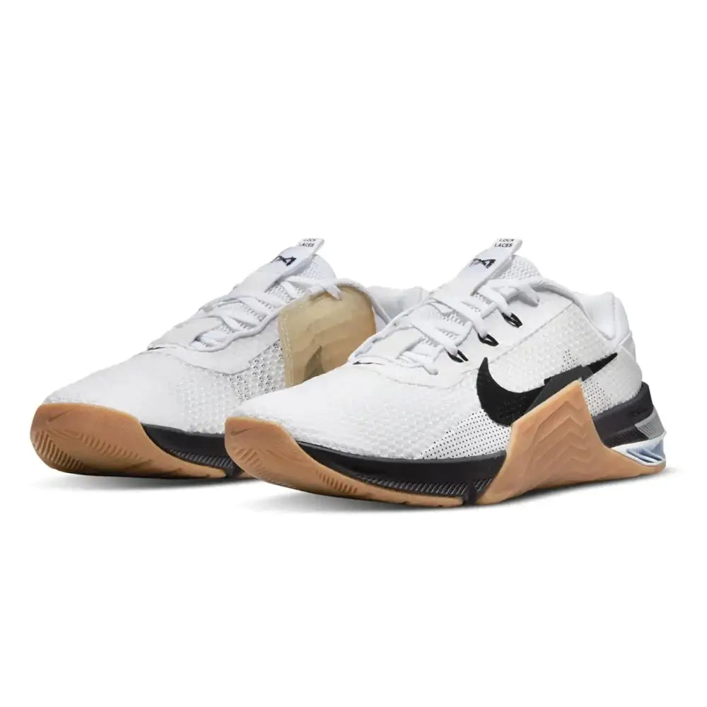 White nike mens gymnastics shoes 48.5 eu with black swoosh and tan rubber sole for training and performance