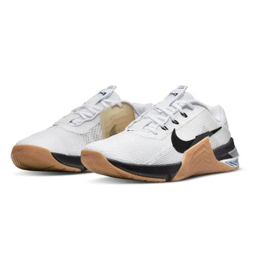 White nike mens gymnastics shoes 48.5 eu with black swoosh and tan rubber sole for training use