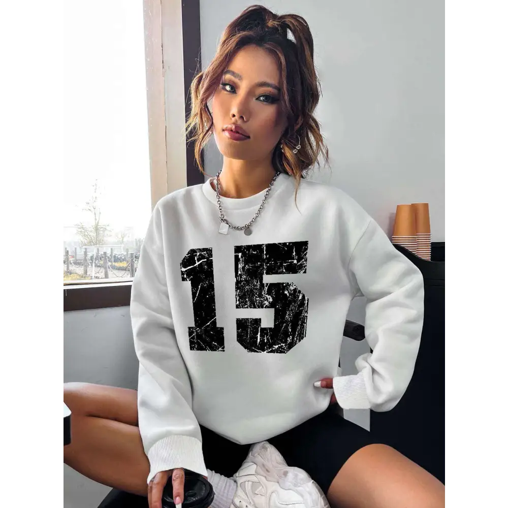 White number 15 graphic crew neck sweatshirt with black distressed marble textured print and ribbed knit cuffs