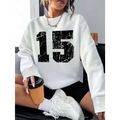 White graphic crew neck sweatshirt with black distressed number 15 graphic and ribbed knit cuffs and hem