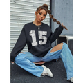 Black distressed graphic crew neck sweatshirt with white number 15 print and ribbed knit cuffs and hem