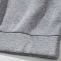 Gray heathered sweatshirt cuff with ribbed knit trim on white number 15 graphic crew neck sweatshirt