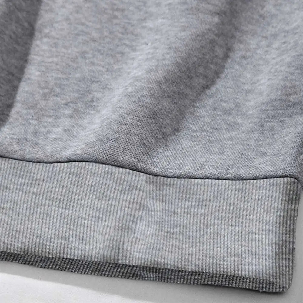 Gray heathered sweatshirt cuff with ribbed knit trim on white number 15 graphic crew neck sweatshirt