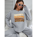 White oversized long sleeve solid colour sweatshirt with a gray oversized long sleeve and motivational quote printed in beige and brown tones