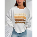 White oversized long sleeve sweatshirt in solid colour with a motivational quote printed in brown and beige tones