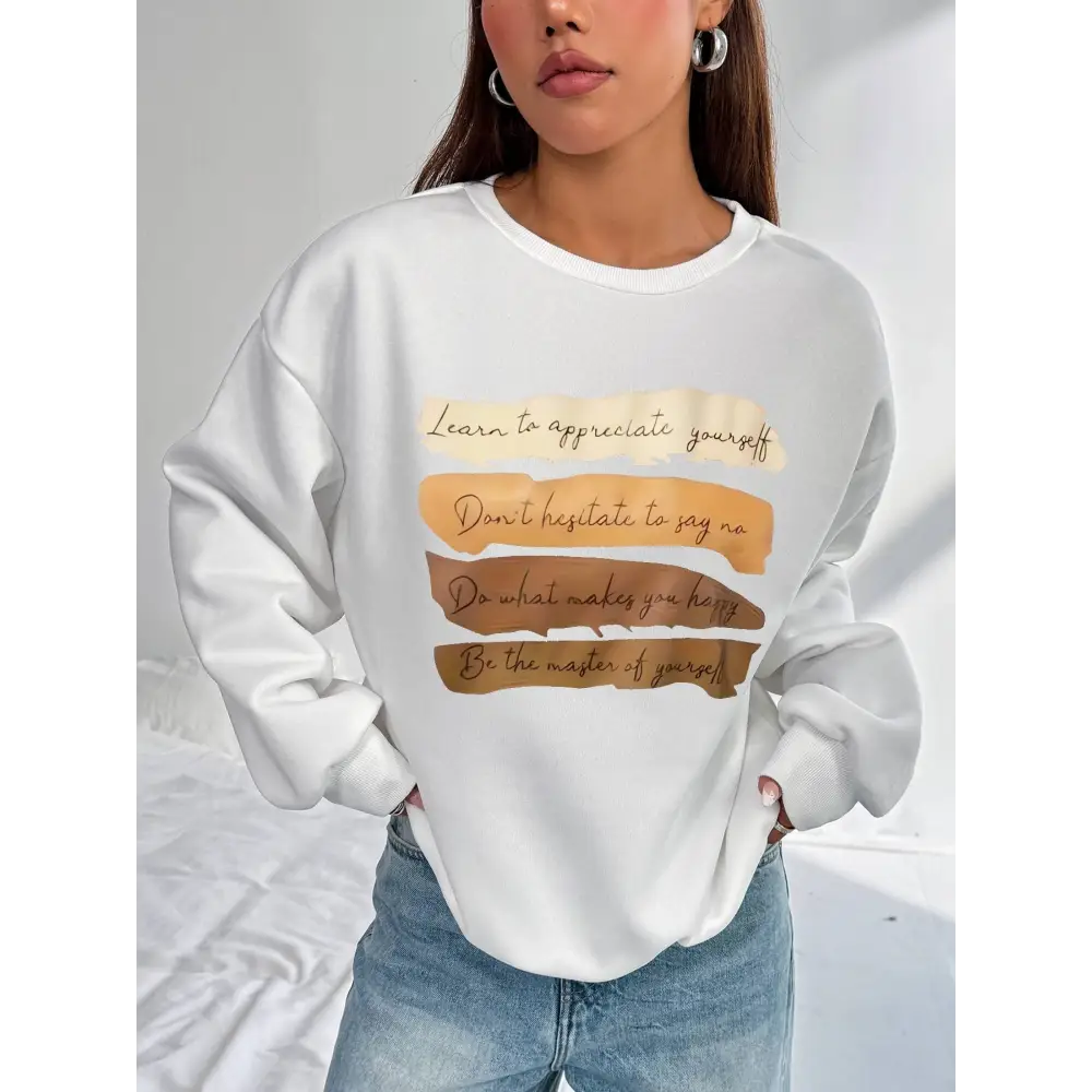 White oversized long sleeve sweatshirt in solid colour with a motivational quote printed in brown and beige tones