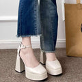 Cream-colored white patent super high heel platform mary janes with thick block heel and ankle strap