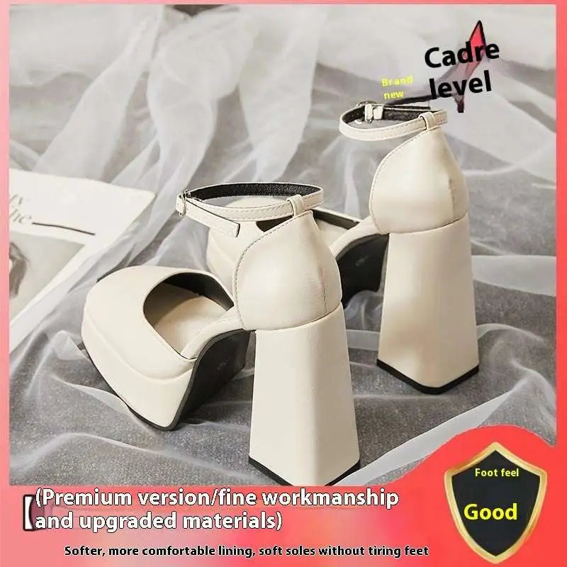 Cream-colored white patent super high heel platform mary janes with sleek minimalist design and black sole accents