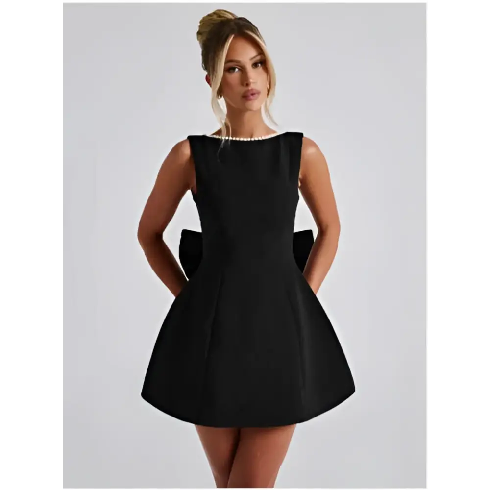 Black sleeveless a-line backless dress summer with pearl embellished neckline and large bow details at the back