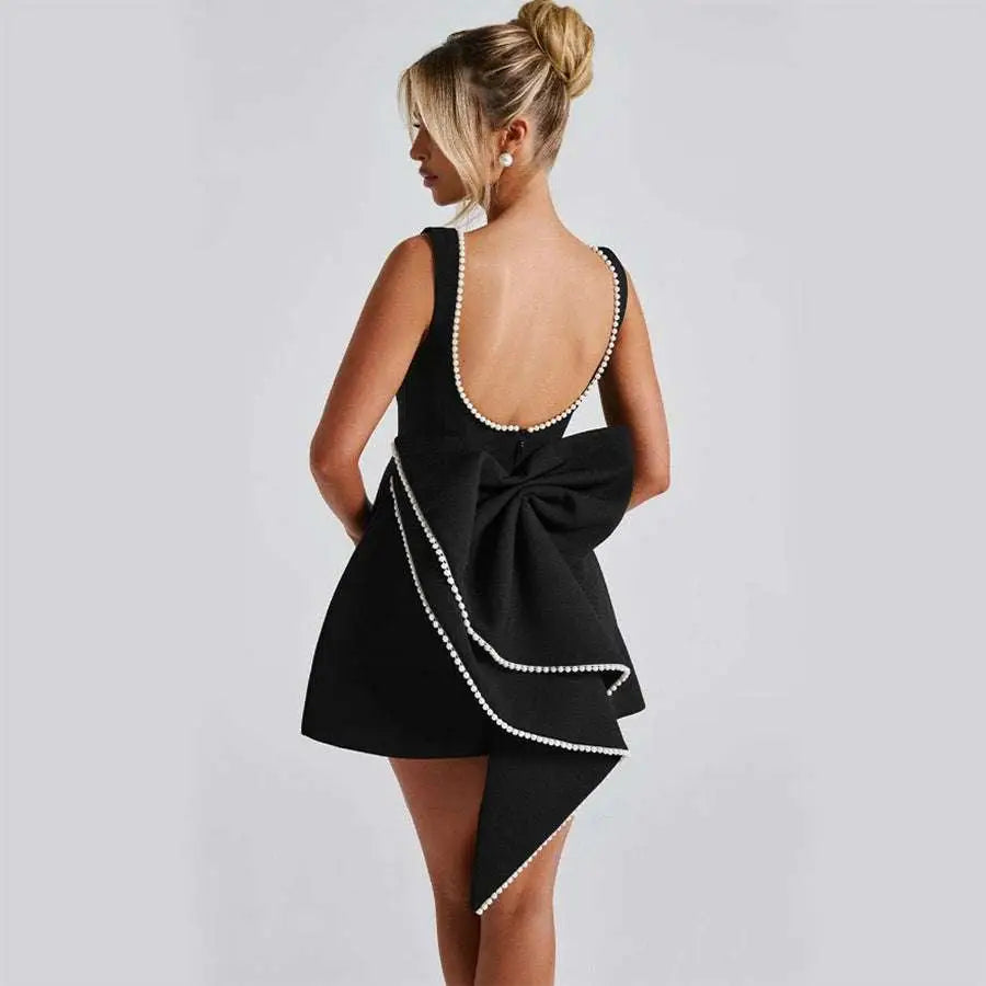 Black sleeveless mini backless dress summer with pearl embellished straps hemline and back bow detail